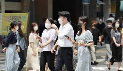 एस कोरिया ने बाहरी समारोहों के लिए मास्क अनिवार्यता हटाने की योजना बनाई
